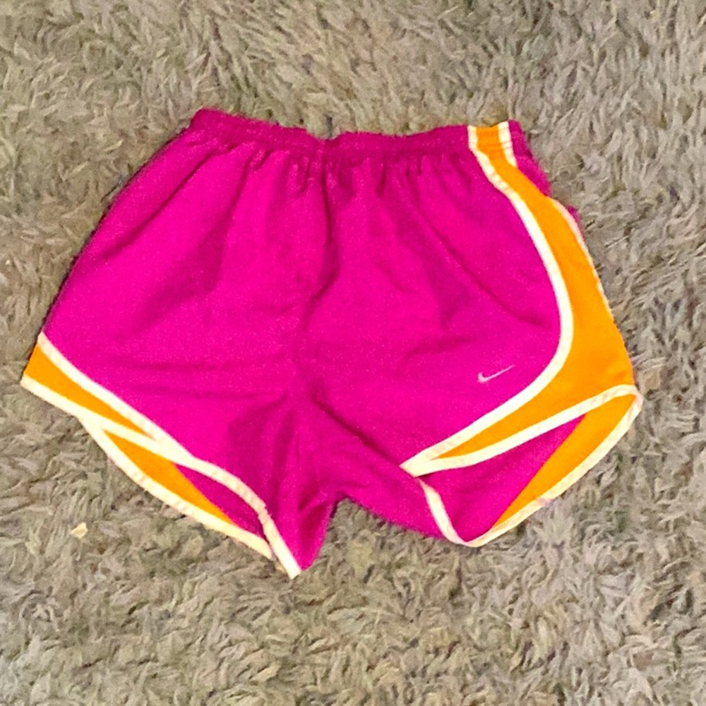 Pink and orange Nike running shorts